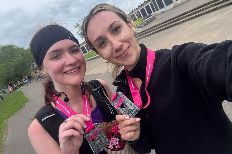 Chloe Rooker (L) after completing Plymouth Half Marathon for charity Luna's Fund.